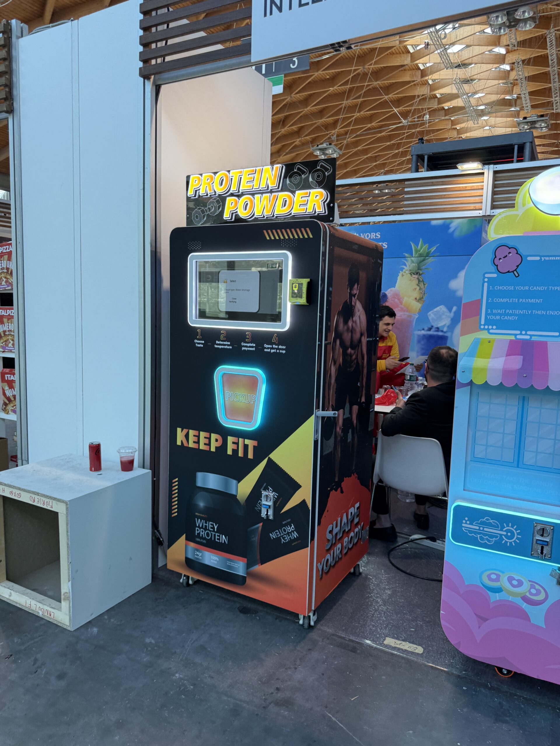 Selection screen on a protein shake vending machine showing flavour options