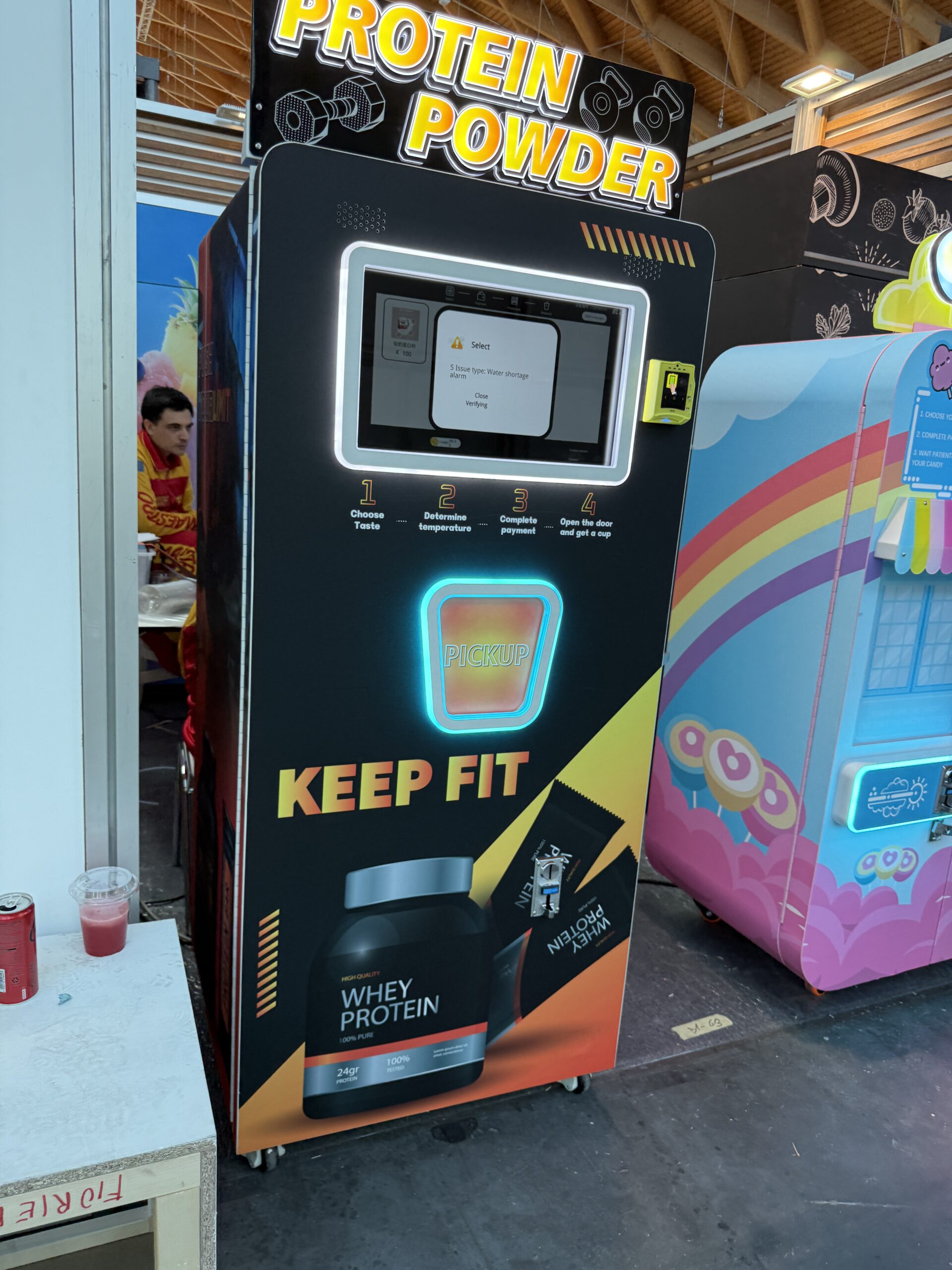 Protein shake vending machine dispensing a freshly mixed drink