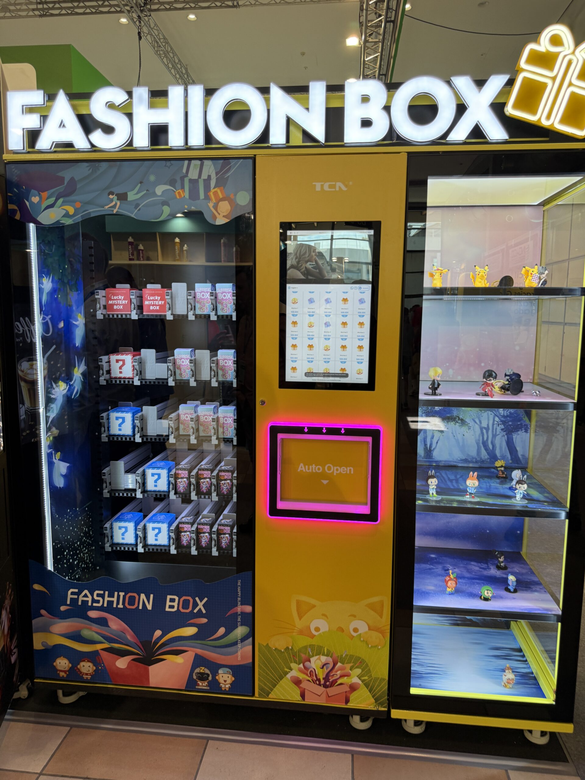 Vending cabinet loaded with sealed mystery boxes and blind box product bought at wholesale for resale