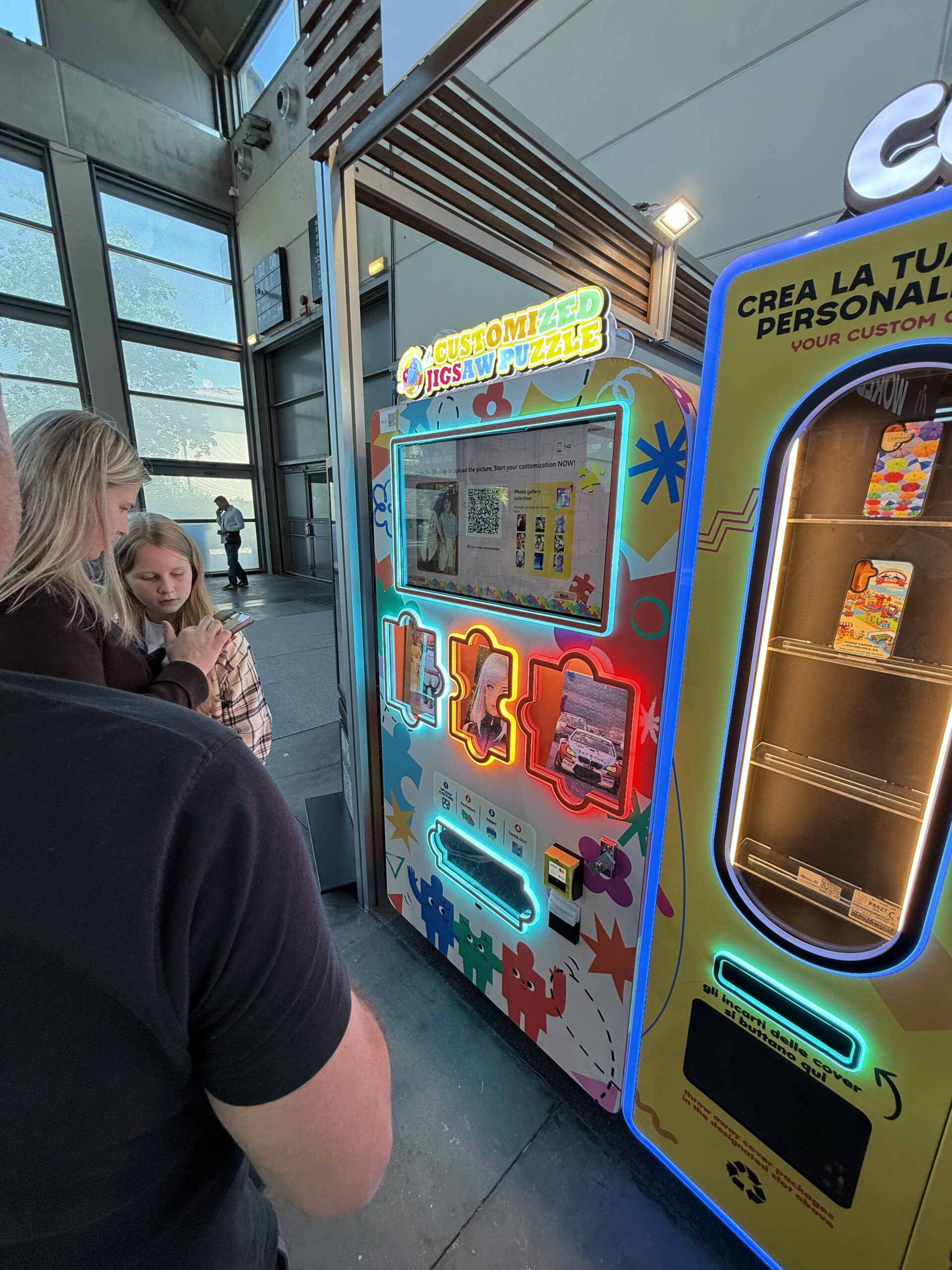 Personalisation vending machine screen showing uploaded photographs