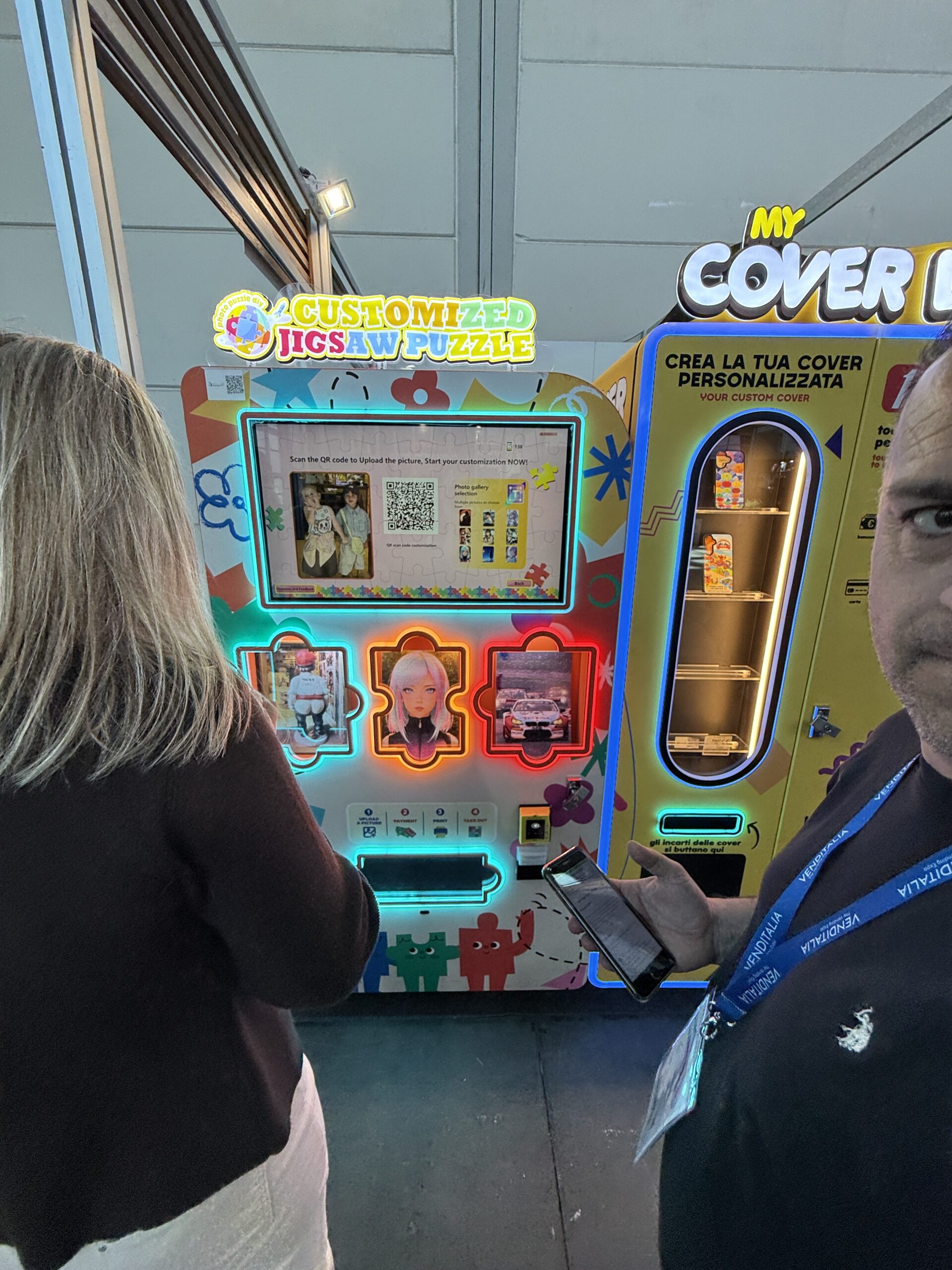 Customised jigsaw puzzle machine beside a phone case machine