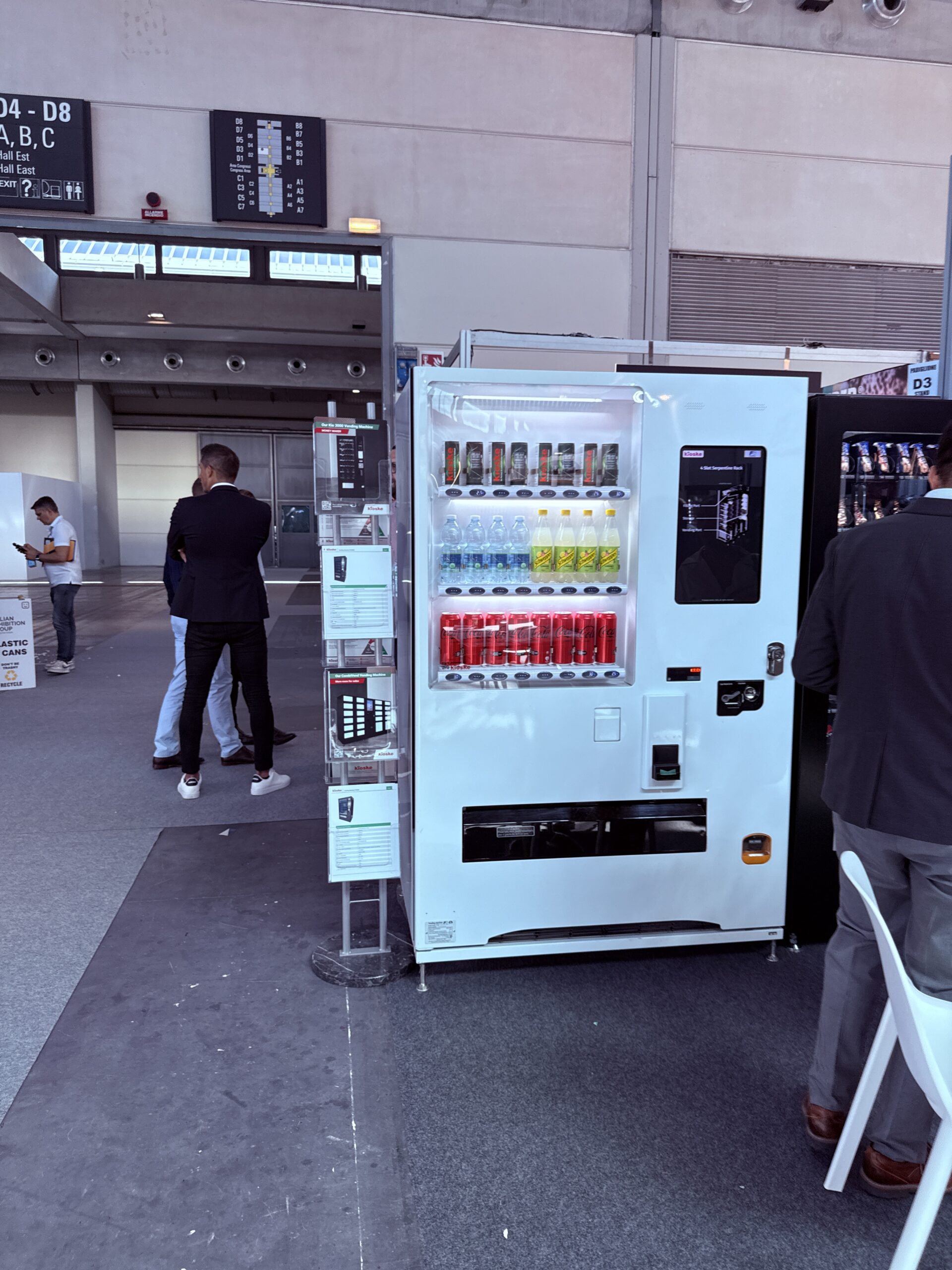 Automated retail installation combining locker compartments and vending