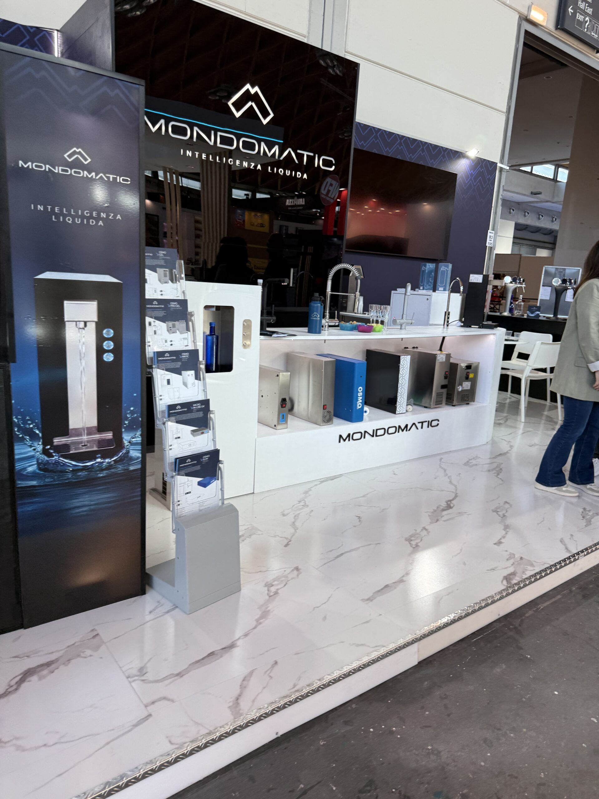 Stainless steel water refill vending machine installed in a public location
