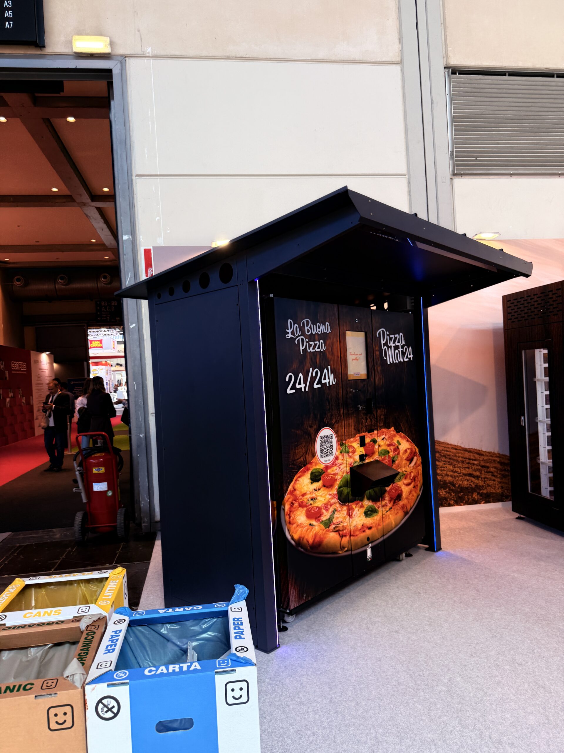 Outdoor pizza vending machine installed on a forecourt