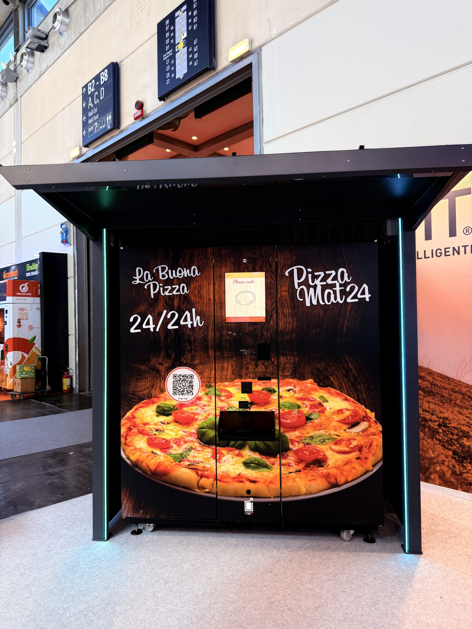 Outdoor pizza vending machine at night